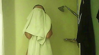Sexy wife getting out of shower on vacation