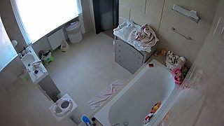 Bathroom voyeur spy of a hot MILF